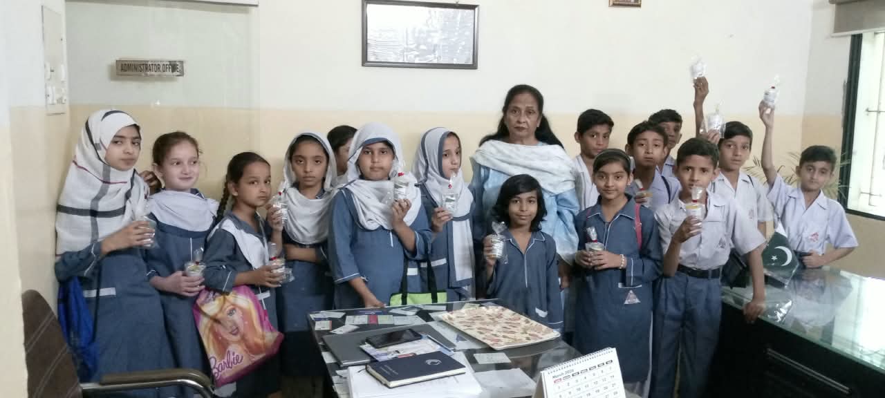 Students with Principal Madam Sabiha Khan during a school activity