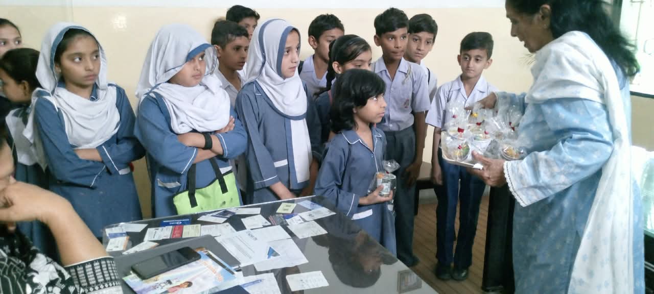 Students receiving gifts during a school activity