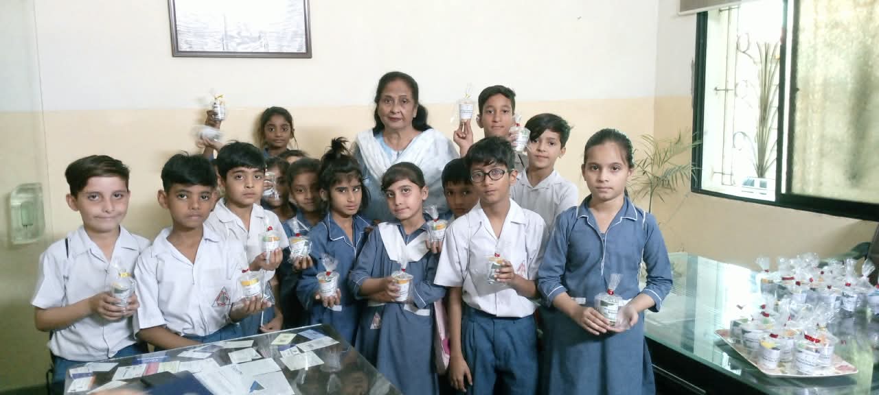 Students gathered with their principal at school